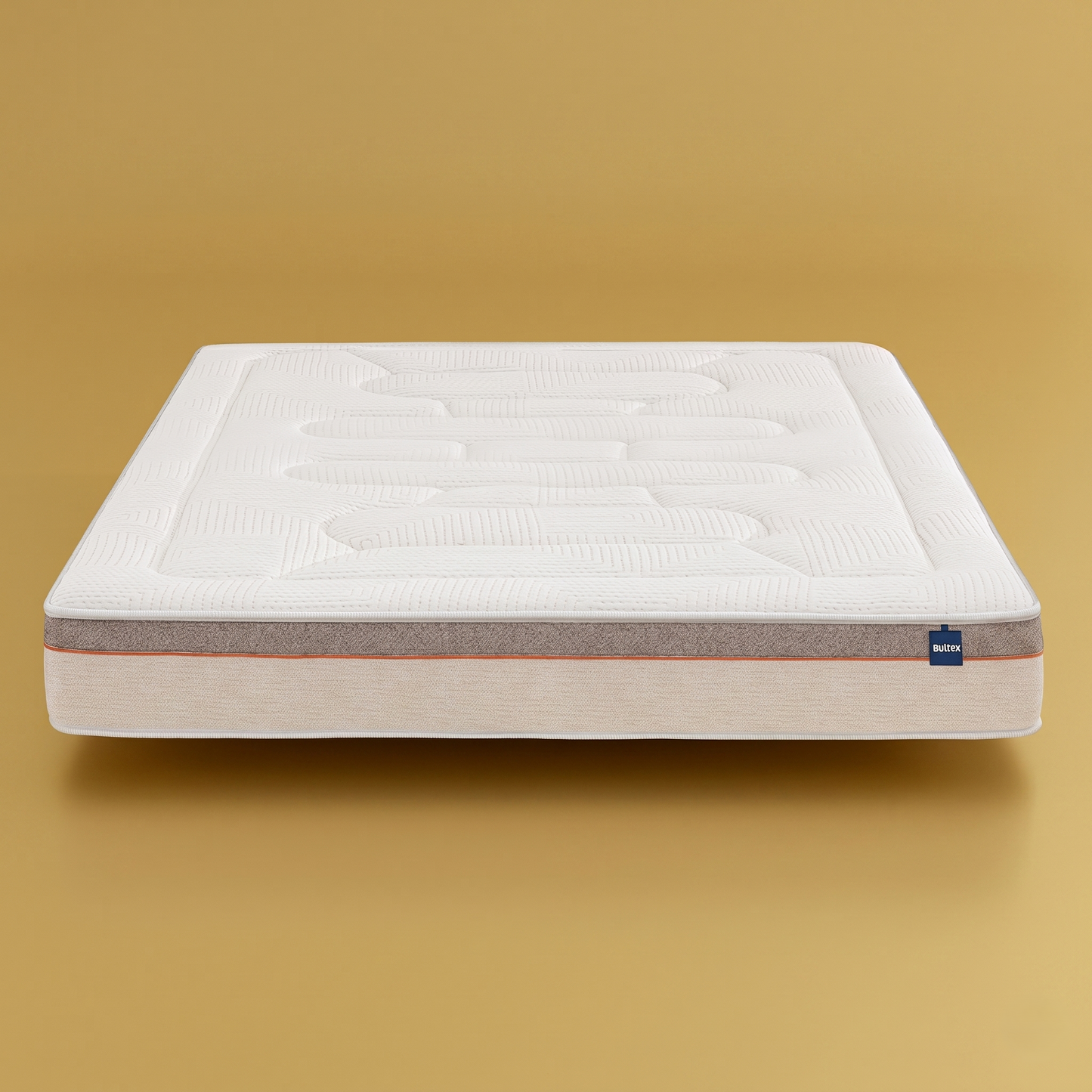 Matelas Bultex Easy Wake : technologie Bultex Nano, design bicolore premium gris/beige chiné, liseré orange distinctif, étiquette visible, sur fond doré brillant.
